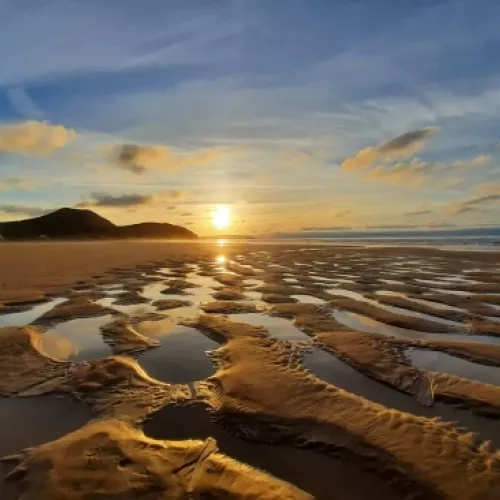 playa de berria santona atardecer marea baja cantabria